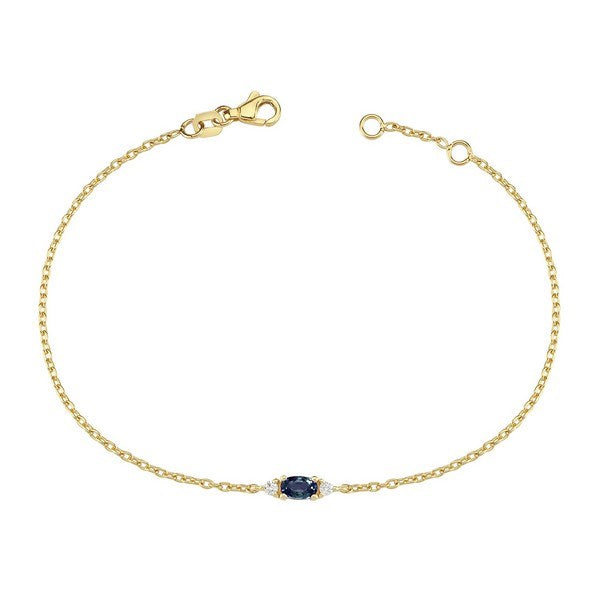 Petit armbånd i 14 kt guld med oval blå safir og diamanter fra Nuran